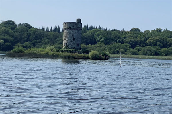 Passing a round tower on Lough Erne